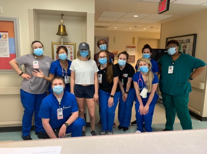 Former Cinco Ranch soccer standout Katie Becker (in white) poses for a photo with nurses and staff of the Memorial Hermann-Texas Medical Center Oncology Unit after being declared cancer-free on July 26.